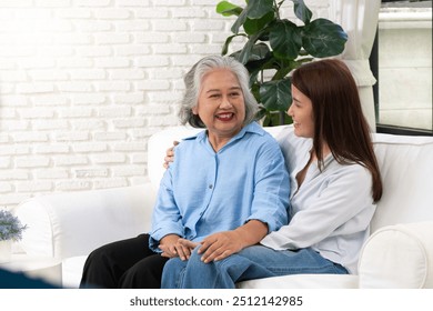 A young woman shares a heartfelt conversation with her mother on a special day, their bond evident in the warmth and affection they express toward each other. - Powered by Shutterstock