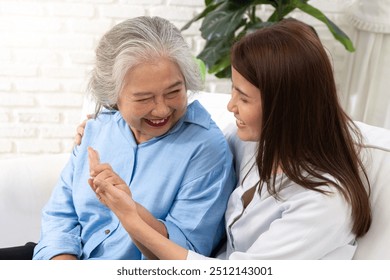 A young woman shares a heartfelt conversation with her mother on a special day, their bond evident in the warmth and affection they express toward each other. - Powered by Shutterstock