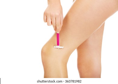 Young Woman Shaving Legs Pink Razor