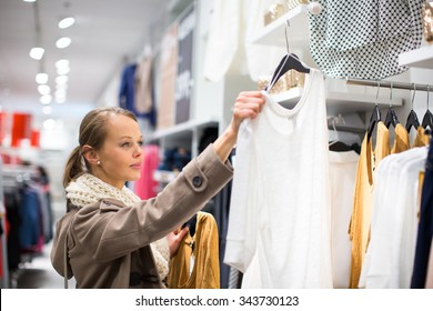 Young Woman Shopping In A Fashion Store (color Toned Image; Shallow DOF)