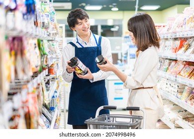 Young woman shopping for groceries at the supermarket - Powered by Shutterstock