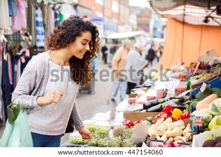 young woman shopping for her fruit and veg