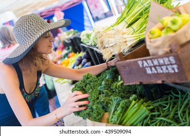 Young Woman Shopping At The Local Farmers Market.