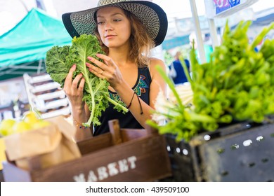 Young Woman Shopping At The Local Farmers Market.