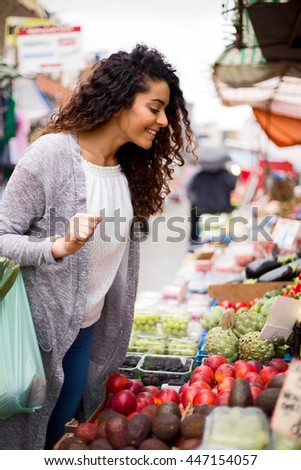 young woman shopping at the market