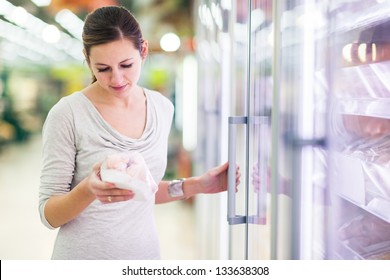 Young Woman Shopping For Meat In A Grocery Store (color Toned Image)