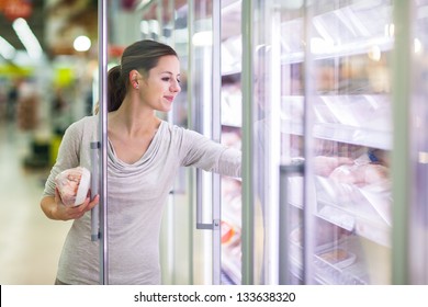 Young Woman Shopping For Meat In A Grocery Store (color Toned Image)