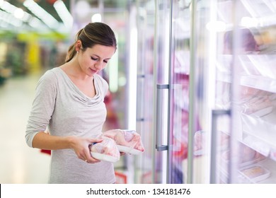 Young Woman Shopping For Meat In A Grocery Store (color Toned Image)