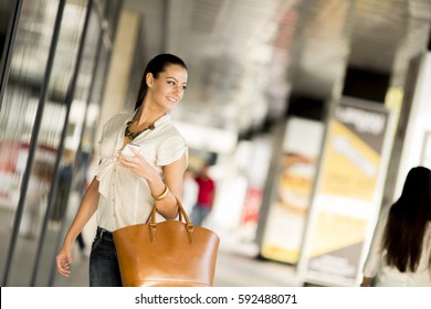 Young Woman In Shopping On Street