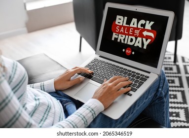 Young Woman Shopping Online On Black Friday At Home