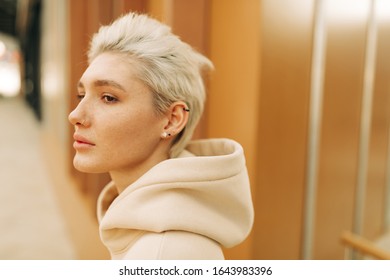 young woman with short blond hair