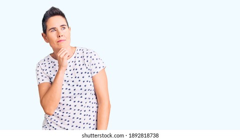 Young Woman With Short Hair Wearing Casual Clothes Serious Face Thinking About Question With Hand On Chin, Thoughtful About Confusing Idea 