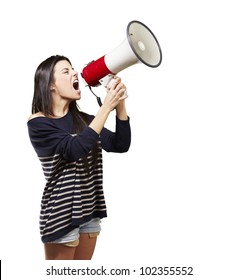 Young Woman Shouting With A Megaphone Against A White Background