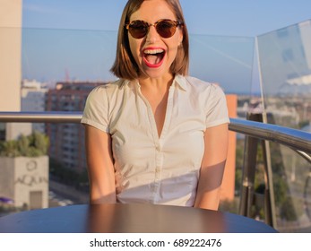 Young Woman Shouting In A Rooftop