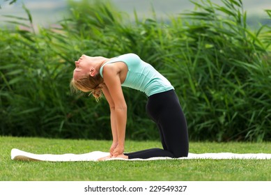 Young Woman Show Camel Yoga Pose