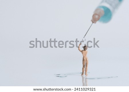 Young woman showers under a medical syringe, miniature figures scene, white background
​