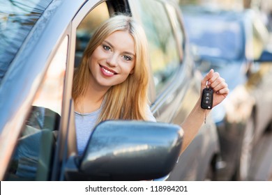 Young Woman Showing Car Key