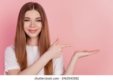 Young woman showing finger direct empty space hand hold advertise object