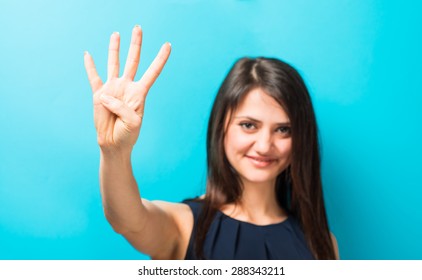 Young Woman Showing Four Fingers