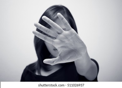 Young Woman Showing Her Denial With NO On Her Hand