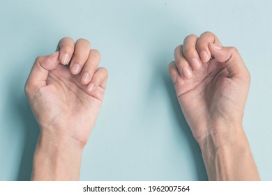 Young Woman Showing Her Fingernails, Hygiene Concept, Keeping Her Fingernails Clean, Reducing The Accumulation Of Germs, Cutting Their Nails Short To Keep Them Clean.