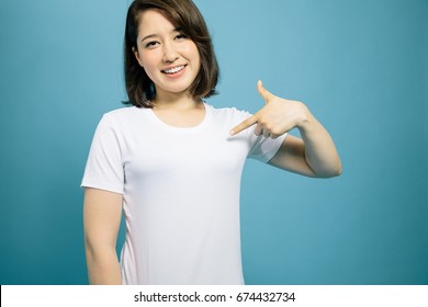 Young Woman Showing Plain White T Shirt.