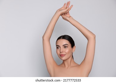 Young woman showing smooth skin after epilation on white background, space for text - Shutterstock ID 2177772533