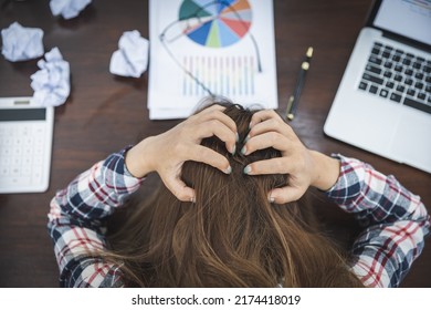 Young woman showing stress while working, failure to work. - Shutterstock ID 2174418019