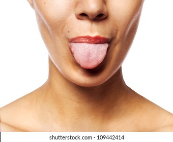 Young woman showing tongue