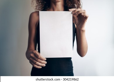 Young Woman Showing A White Blank Page Of Clipboard