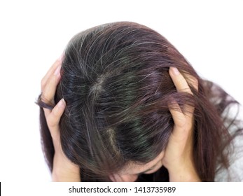 Young Woman Shows Her Gray Hair Roots On White Background