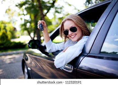 Young Woman Shows The Keys To Her New Car