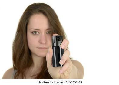 young woman shows open hand before white background, isolated, studio shot