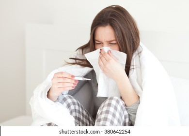 Young Woman Sick In Bed