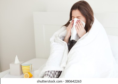 Young woman sick in bed