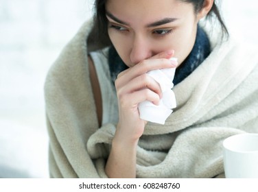 Young woman sick in bed with temperature drinks hot  - Shutterstock ID 608248760