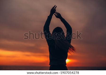 Similar – woman beach sunset horizon