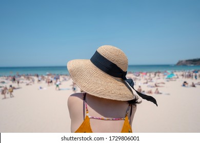 Young Woman Sitting At Bondi Beach. Sydney, Australia.