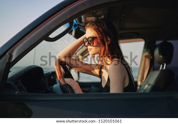 young woman sitting\
in a car resting model