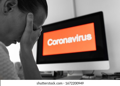 Young Woman Sitting At Computer Feeling Stress Fearful Over Coronavirus 2019-ncov