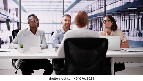 Young Woman Sitting At Interview In Office - Powered by Shutterstock