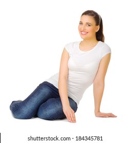 Young Woman Sitting On The Floor Isolated