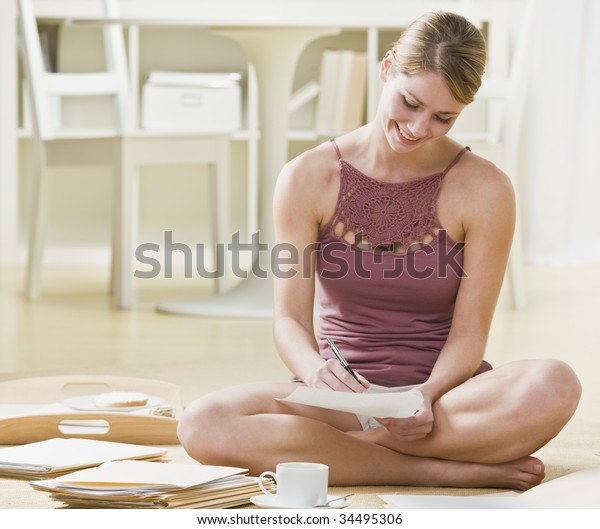 Young Woman Sitting On Floor Writing Stock Photo Edit Now 34495306