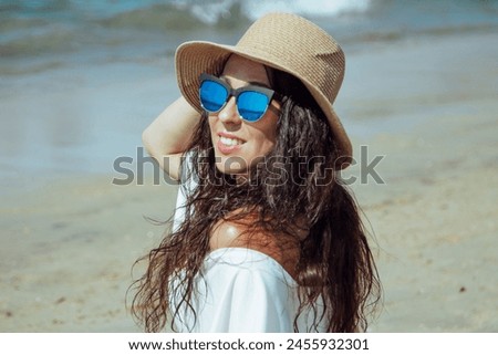 Similar – Brunette surfer woman in bikini standing with surfboard