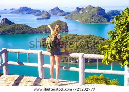 Young woman sitting at the view point, Wua Talab island, Ang Thong National Marine Park, Thailand, beautiful girl look at the islands