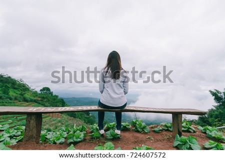 young woman sitting waits someone female stock photo edit now