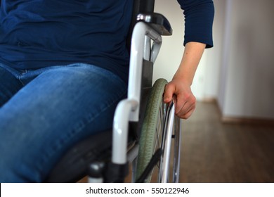Young woman sitting in a wheelchair