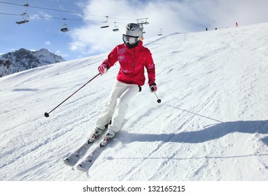 Young Woman Skiing. Alps