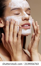 young woman skin care by using white mask on the face isolated background - Shutterstock ID 2139056763