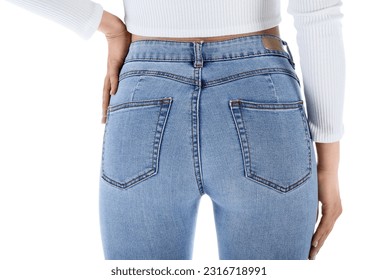 Young woman in skinny jeans on white background, back view